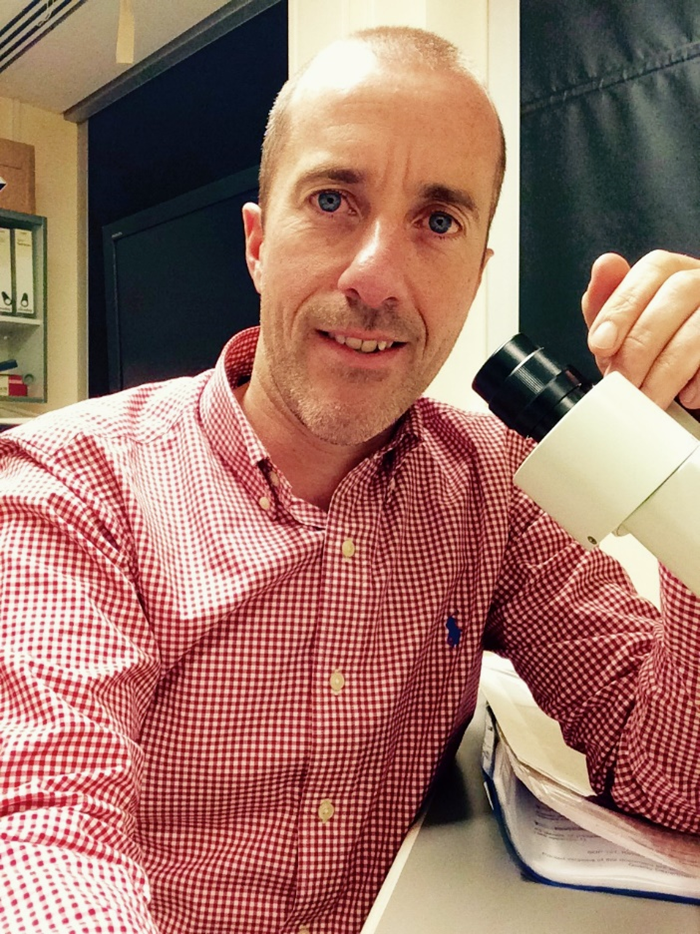 a man at microscope