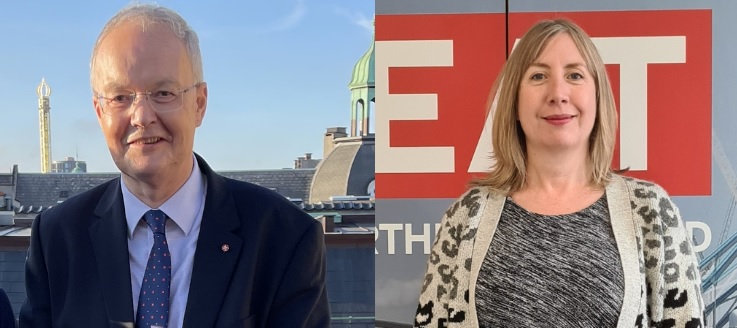 Man smiling dressed in a suit